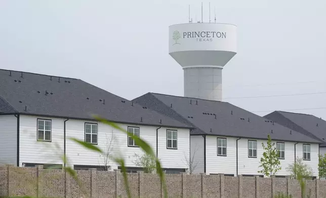 A water tower bears the name of the town, Princeton, Texas, Friday, May 16, 2025. (AP Photo/LM Otero)