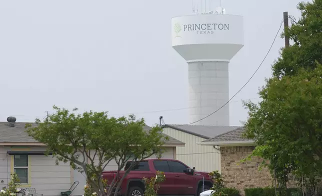 A water tower bears the name of the town, Princeton, Texas, Friday, May 16, 2025. (AP Photo/LM Otero)