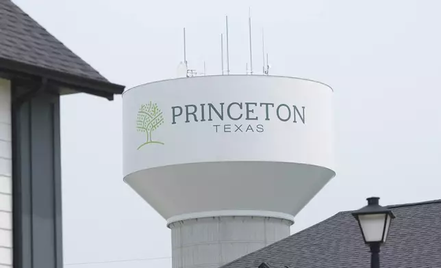 A water tower bears the name of the town, Princeton, Texas, Friday, May 16, 2025. (AP Photo/LM Otero)