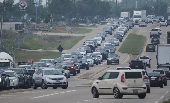 Traffic is seen in Princeton, Texas, Friday, May 16, 2025. (AP Photo/LM Otero)