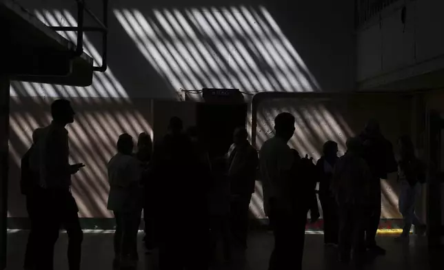 Visitors walk inside the prison on Alcatraz Island Monday, May 5, 2025, in San Francisco. (AP Photo/Jed Jacobsohn)