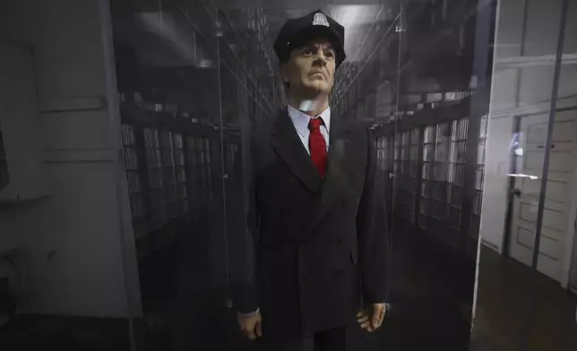 A mannequin is dressed as a prison guard as visitors tour Alcatraz Island Monday, May 5, 2025, in San Francisco. (AP Photo/Jed Jacobsohn)