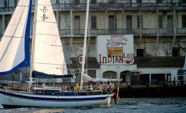 A sailboat passes Alcatraz Island on Sunday, May 4, 2025, in the San Francisco Bay, Calif. (AP Photo/Noah Berger)