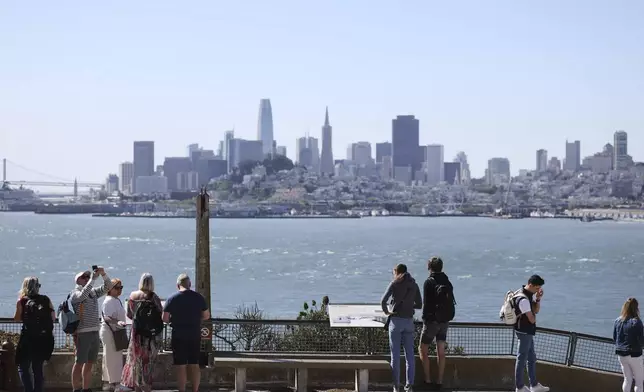 Visitors view the downtown skyline from Alcatraz Island Monday, May 5, 2025, in San Francisco. (AP Photo/Jed Jacobsohn)
