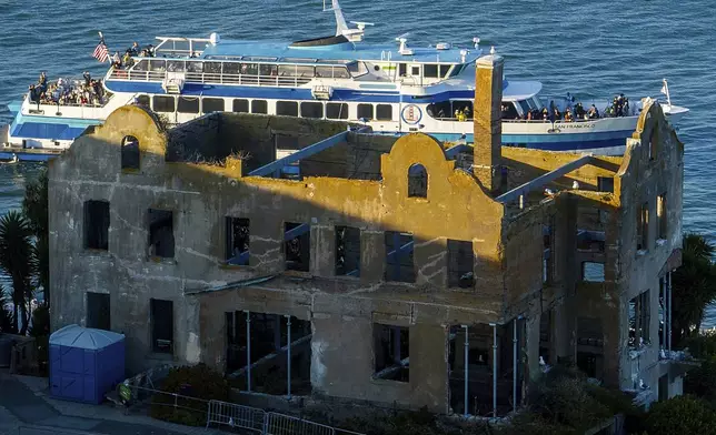 A ferry departs from Alcatraz Island on Sunday, May 4, 2025, in the San Francisco Bay, Calif. (AP Photo/Noah Berger)