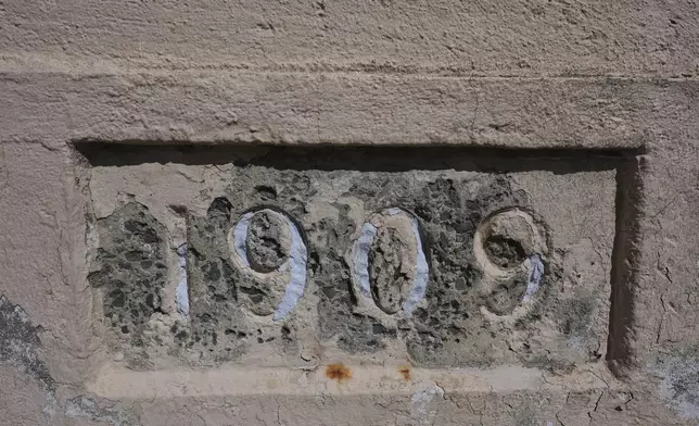 The year 1909 is carved on a wall on Alcatraz Island, Monday, May 5, 2025, in San Francisco. (AP Photo/Jed Jacobsohn)