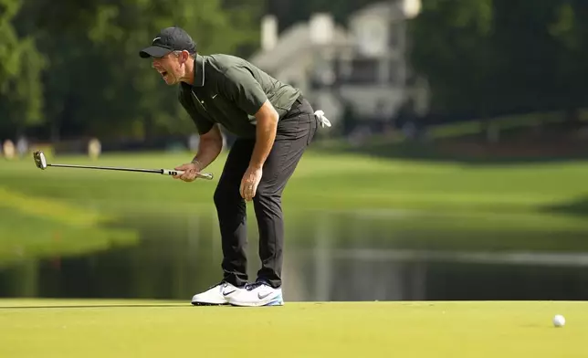 Rory McIlroy, of Northern Ireland, reacts after missing a putt on the 16th hole during the first round of the PGA Championship golf tournament at the Quail Hollow Club, Thursday, May 15, 2025, in Charlotte, N.C. (AP Photo/David J. Phillip)