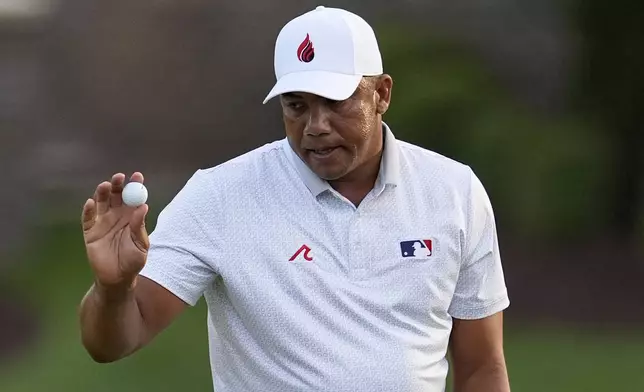 Jhonattan Vegas, of Venezuela, waves after making a putt on the seventh hole during the first round of the PGA Championship golf tournament at the Quail Hollow Club, Thursday, May 15, 2025, in Charlotte, N.C. (AP Photo/George Walker IV)