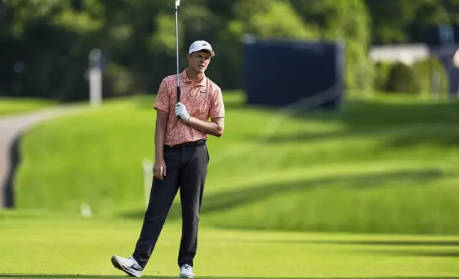 Cameron Davis, of Australia, hits from the fairway on the ninth hole during the first round of the PGA Championship golf tournament at the Quail Hollow Club, Thursday, May 15, 2025, in Charlotte, N.C. (AP Photo/George Walker IV)