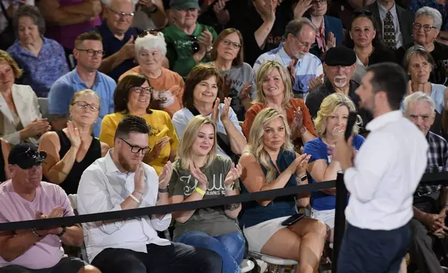 The audience applauds former U.S. Secretary of Transportation Pete Buttigieg during a VoteVets Town Hall, Tuesday, May 13, 2025, in Cedar Rapids, Iowa. (AP Photo/Cliff Jette)