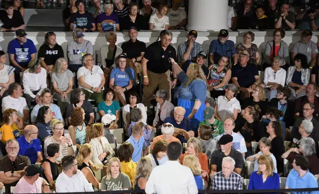 An audience member asks a question of former U.S. Secretary of Transportation Pete Buttigieg during a VoteVets Town Hall, Tuesday, May 13, 2025, in Cedar Rapids, Iowa. (AP Photo/Cliff Jette)