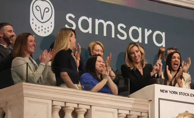 Meagen Eisenberg, second from right, Chief Marketing Officer of Samsara, gavels trading closed at the New York Stock Exchange, Tuesday, May 20, 2025. (AP Photo/Richard Drew)