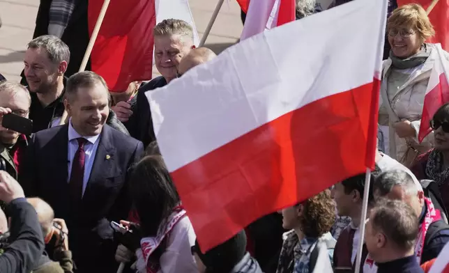 FILE - Right-wing candidate Karol Nawrocki, left, takes part in a patriotic demonstration celebrating 1,000 years since the coronation of the first Polish king, Saturday, April 12, 2025 ,in Warsaw, Poland. (AP Photo/Czarek Sokolowski, File)