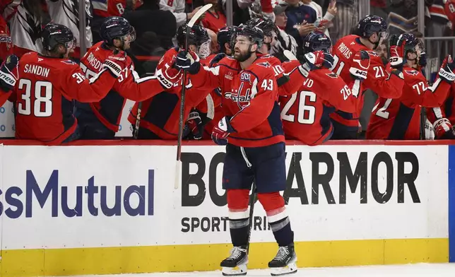 Washington Capitals right wing Tom Wilson (43) celebrates his goal in the second period of Game 5 of a first-round NHL hockey playoff series against the Montreal Canadiens, Wednesday, April 30, 2025, in Washington. (AP Photo/Nick Wass)