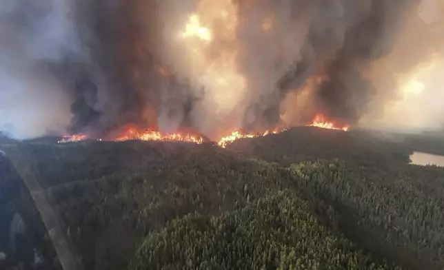 This photo provided by the Manitoba government shows wildfires in Sherridon, Manitoba, Canada, on Tuesday, May 27, 2025. (Manitoba government via AP)