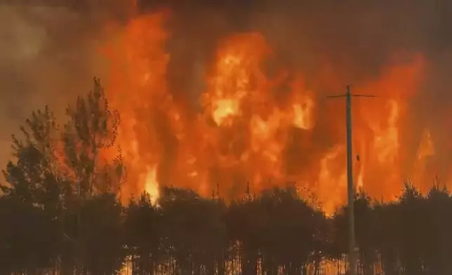 This photo provided by the Manitoba government shows wildfires in Wanless, Manitoba, Canada on Thursday, May 29, 2025. (Manitoba government via AP)