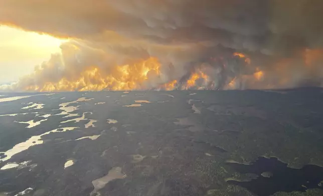 This photo provided by the Manitoba government shows wildfires in Flin Flon, Manitoba, Canada on Tuesday, May 27, 2025. (Manitoba government via AP)