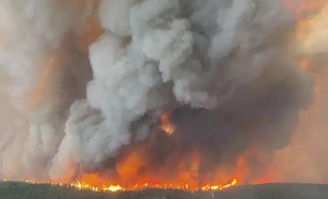 This photo provided by the Manitoba government shows wildfires in Sherridon, Manitoba, Canada on Tuesday, May 27, 2025. (Manitoba government via AP)
