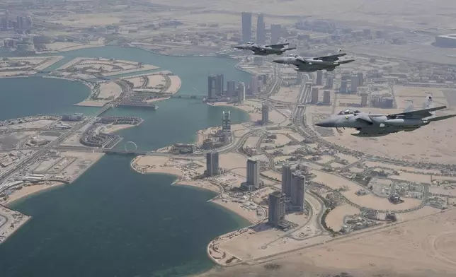 Qatar Emiri Air Force F-15s provide an honorary escort for Air Force One, carrying President Donald Trump, as it arrives in Doha, Qatar, Wednesday, May 14, 2025. (AP Photo/Alex Brandon)