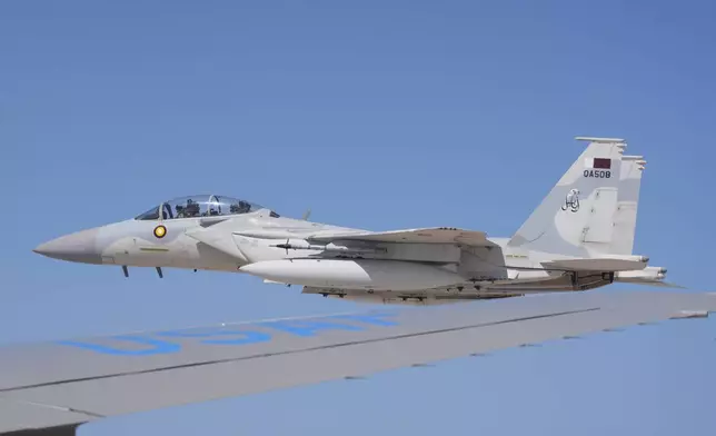 Qatar Emiri Air Force F-15s provide an honorary escort for Air Force One, carrying President Donald Trump, as it arrives in Doha, Qatar, Wednesday, May 14, 2025. (AP Photo/Alex Brandon)