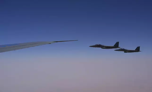 Royal Saudi Air Force F-15s provide an honorary escort for Air Force One, with President Donald Trump aboard, as it arrives in Saudi Arabia, Tuesday, May 13, 2025. (AP Photo/Alex Brandon)
