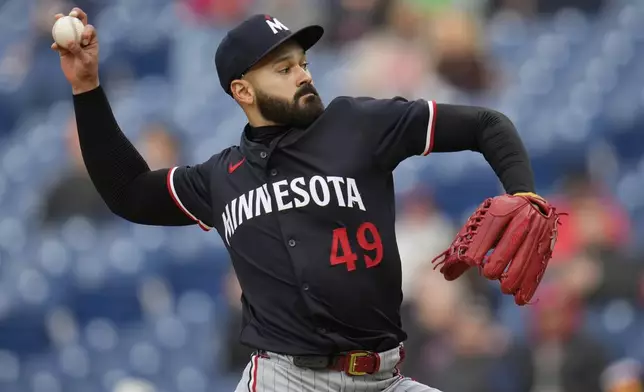 Minnesota Twins' Pablo Lopez pitches in the first inning of a baseball game against the Cleveland Guardians in Cleveland, Wednesday, April 30, 2025. (AP Photo/Sue Ogrocki)