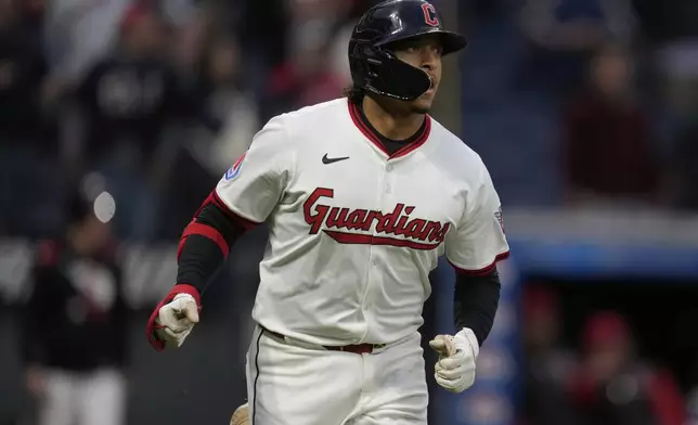 Cleveland Guardians' Bo Naylor watches his home run in the seventh inning of a baseball game against the Minnesota Twins in Cleveland, Wednesday, April 30, 2025. (AP Photo/Sue Ogrocki)