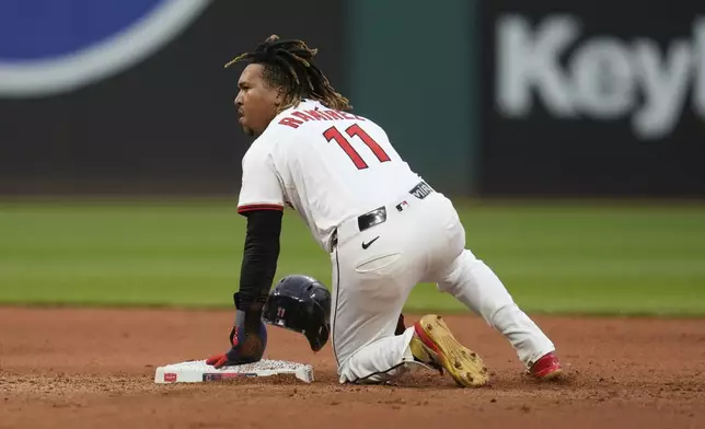 Cleveland Guardians' Jose Ramirez (11) steals second base in the seventh inning of a baseball game against the Minnesota Twins in Cleveland, Wednesday, April 30, 2025. (AP Photo/Sue Ogrocki)