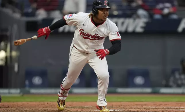 Cleveland Guardians' Jose Ramirez tosses his bat as he watches his single in the seventh inning of a baseball game against the Minnesota Twins in Cleveland, Wednesday, April 30, 2025. (AP Photo/Sue Ogrocki)