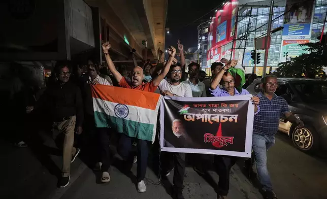 People holding Indian national flags rally's in support of the Indian Army as they celebrate the success of 'Operation Sindoor', in Guwahati, India, Thursday, May 8, 2025. (AP Photo/Anupam Nath)