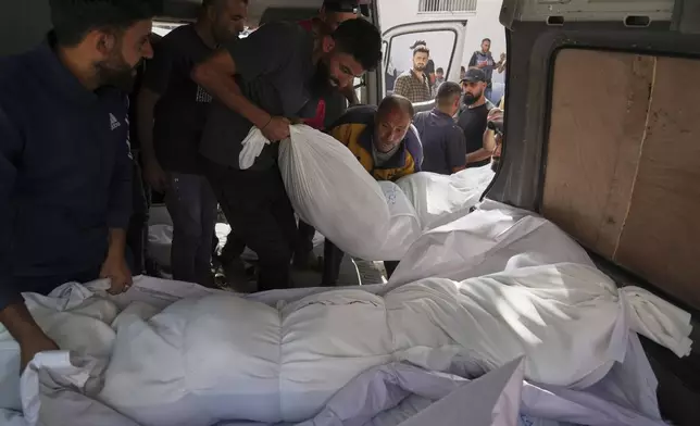 Bodies of Palestinians killed in the Israeli army airstrikes are brought to Al-Shifa Hospital in Gaza City, Monday, May 26, 2025. (AP Photo/Jehad Alshrafi)