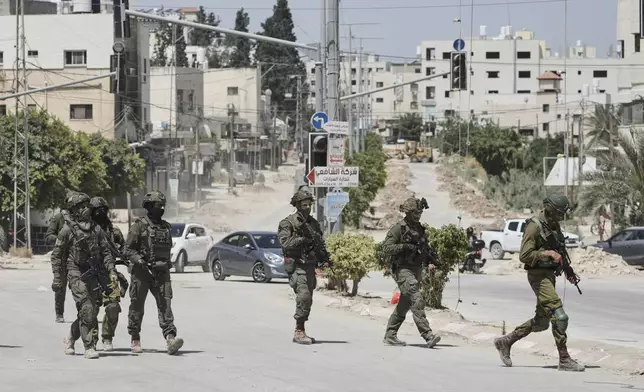 Israeli soldiers are seen during an army operation in Tulkarem, West Bank on Monday, May 26, 2025. (AP Photo/Majdi Mohammed)