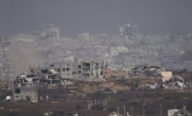 Israeli tanks manuver inside Gaza Strip as seen from southern Israel, Monday, May 26, 2025. (AP Photo/Ariel Schalit)