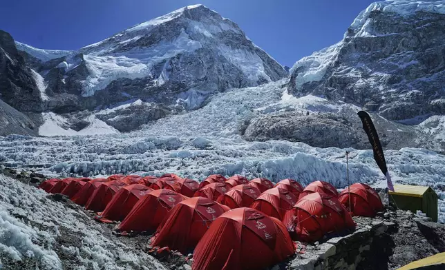 Khumbu Icefall is visible between two peaks in the background at the Everest Base Camp in Nepal, April 25, 2025. (AP Photo/Pasang Rinzee Sherpa)