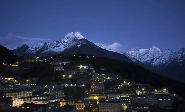 Mount Thamserku rises above the town of Namche Bazaar in Nepal, April 18, 2025. (AP Photo/Pasang Rinzee Sherpa)