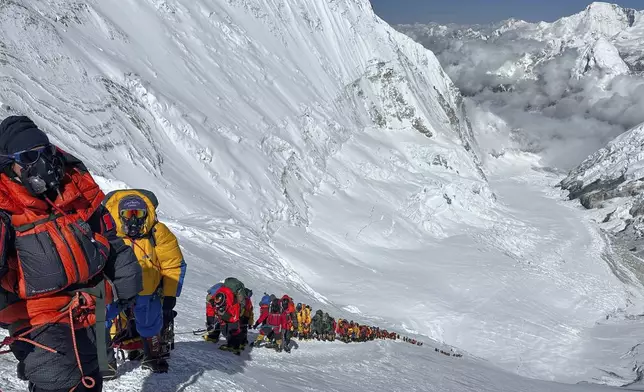 Mountaineers queue up below Camp 4 on the way to the summit of Mount Everest in Nepal, May 17, 2025. (AP Photo/Jenjen Lama)