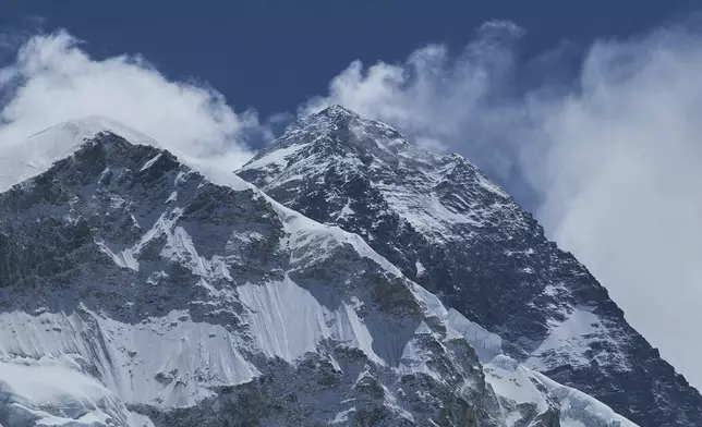 Mount Everest, right, is seen from the Khumbu region which lies on the way to the summit, in Nepal, May 7, 2025. (AP Photo/Pasang Rinzee Sherpa)