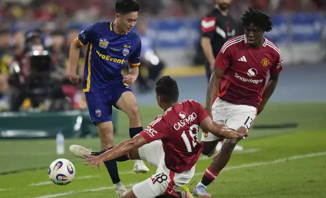 ASEAN All-Star Philippines's Sandro Reyes, left, fights for the ball with Manchester United's Casemiro, center, and Patrick Dorgu during the Challenge Cup Malaysia 2025 soccer tournament in Kuala Lumpur, Malaysia, Wednesday, May 28, 2025. (AP Photo/Vincent Thian)
