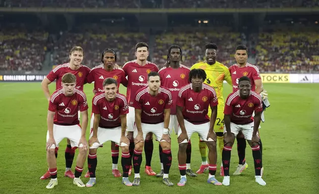 Manchester United's team poses for photo before friendly match with ASEAN All-Star team during the Challenge Cup Malaysia 2025 soccer tournament in Kuala Lumpur, Malaysia, Wednesday, May 28, 2025. (AP Photo/Vincent Thian)