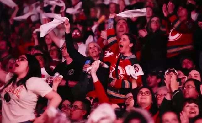 Ottawa Charge fans cheer before the start of the PWHL's Walter Cup Final against the Minnesota Frost, in Ottawa, on Tuesday, May 20, 2025. (Justin Tang/The Canadian Press via AP)