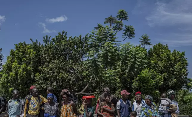 Rwandan refugees who were living in eastern Congo since the 1994 Rwanda genocide wait for repatriation from Goma, Democratic Republic of the Congo, on Saturday, May 17, 2025. (AP Photo/Moses Sawasawa)