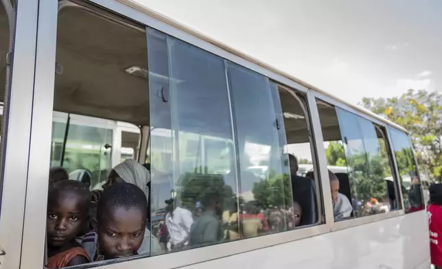 Rwandan refugees who were living in eastern Congo since the 1994 Rwanda genocide are repatriated by bus from Goma, Democratic Republic of the Congo, on Saturday, May 17, 2025. (AP Photo/Moses Sawasawa)