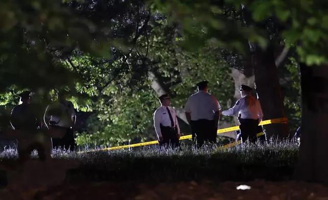 Philadelphia Police investigate a multiple fatal shooting at Lemon Hill Drive in Fairmount Park on Monday, May 26, 2025. (Yong Kim/The Philadelphia Inquirer via AP)
