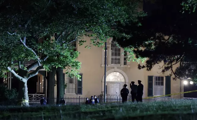 Philadelphia Police investigate the crime scene in front of Lemon Hill Mansion in the early morning hours of Tuesday, May 27, 2025. (Elizabeth Robertson/The Philadelphia Inquirer via AP)