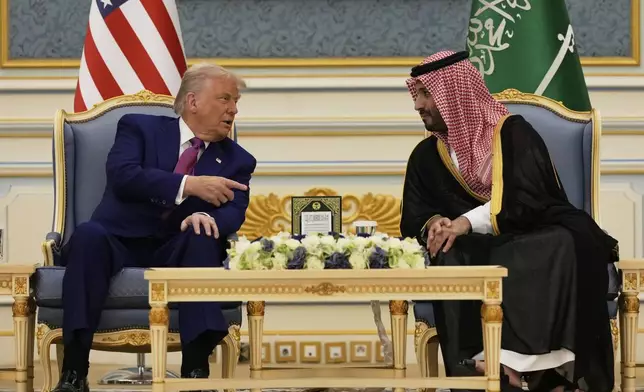 President Donald Trump and Saudi Crown Prince Mohammed bin Salman speak during a meeting at the Royal Palace in Riyadh, Saudi Arabia, Tuesday, May 13, 2025. (AP Photo/Alex Brandon)