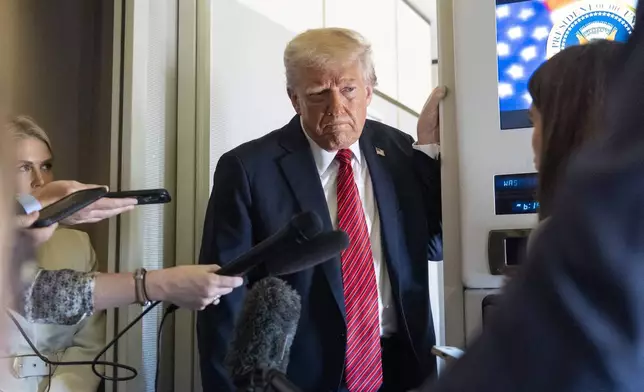 President Donald Trump speaks to reporters aboard Air Force One en route from Riyadh, Saudi Arabia to Doha, Qatar, Wednesday, May 14, 2025. (AP Photo/Alex Brandon)