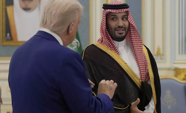 President Donald Trump and Saudi Crown Prince Mohammed bin Salman speak at the Royal Palace in Riyadh, Saudi Arabia, Tuesday, May 13, 2025. (AP Photo/Alex Brandon)