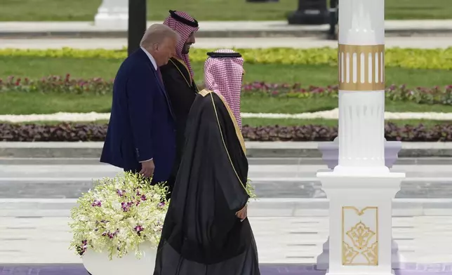 President Donald Trump walks with Saudi Crown Prince Mohammed bin Salman during a welcome ceremony at the Royal Palace in Riyadh, Saudi Arabia, Tuesday, May 13, 2025. (AP Photo/Alex Brandon)