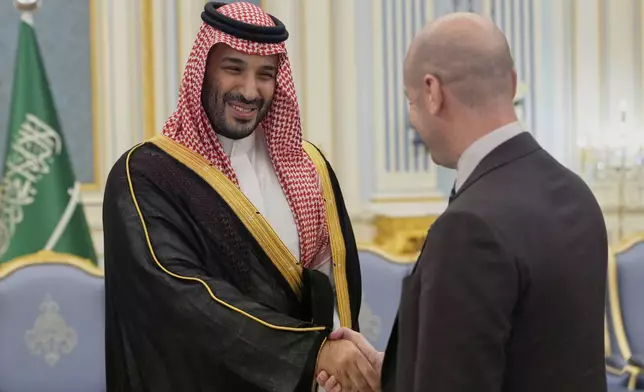 Saudi Crown Prince Mohammed bin Salman greets White House Deputy Chief of Staff Stephen Miller at the Royal Palace in Riyadh, Saudi Arabia, Tuesday, May 13, 2025. (AP Photo/Alex Brandon)