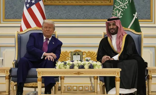 President Donald Trump and Saudi Crown Prince Mohammed bin Salman speak during a meeting at the Royal Palace in Riyadh, Saudi Arabia, Tuesday, May 13, 2025. (AP Photo/Alex Brandon)